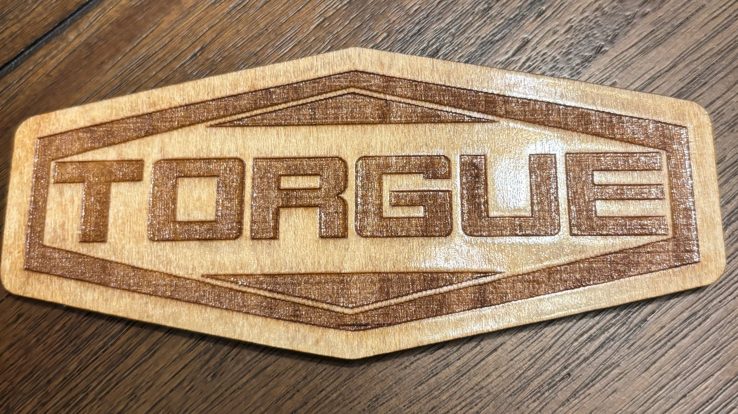 Stained basswood fridge magnet of the Torgue logo from the Borderlands video games
