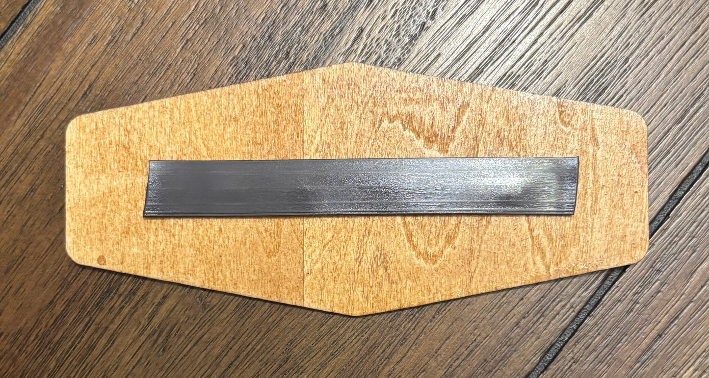 Stained basswood fridge magnet of the Torgue logo from the Borderlands video games