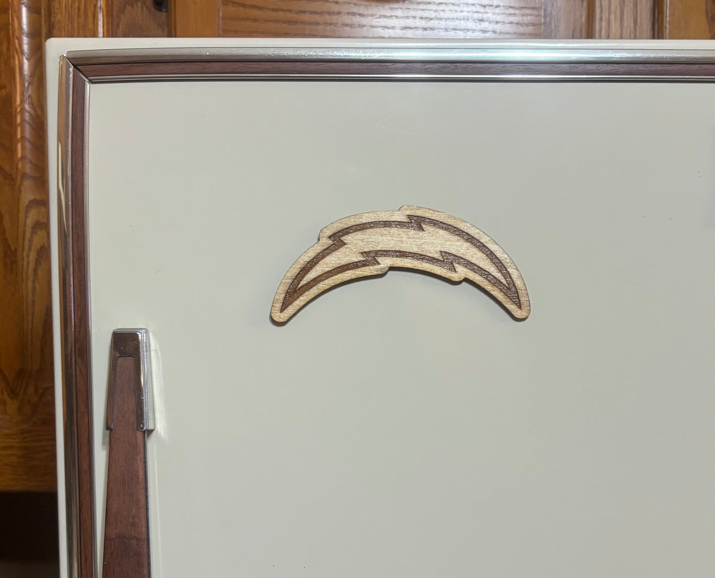 Stained basswood fridge magnet of the Los Angeles Chargers football team logo