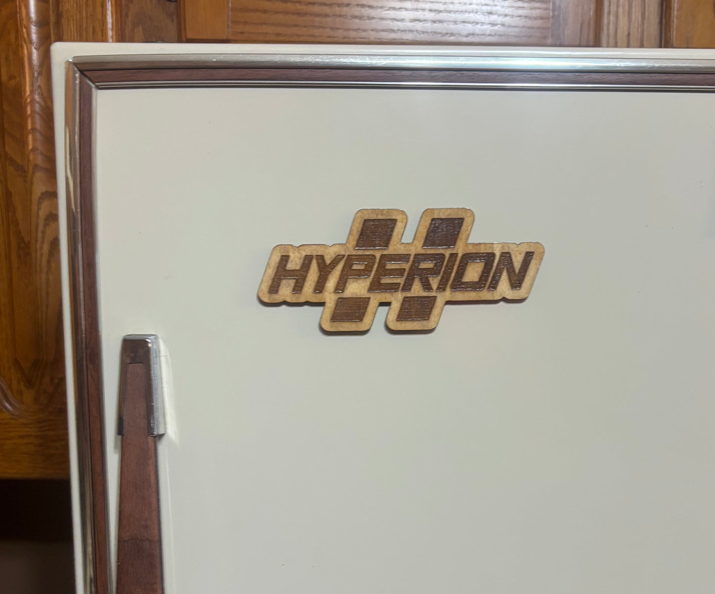 Stained basswood fridge magnet of the Hyperion logo from the Borderlands video games