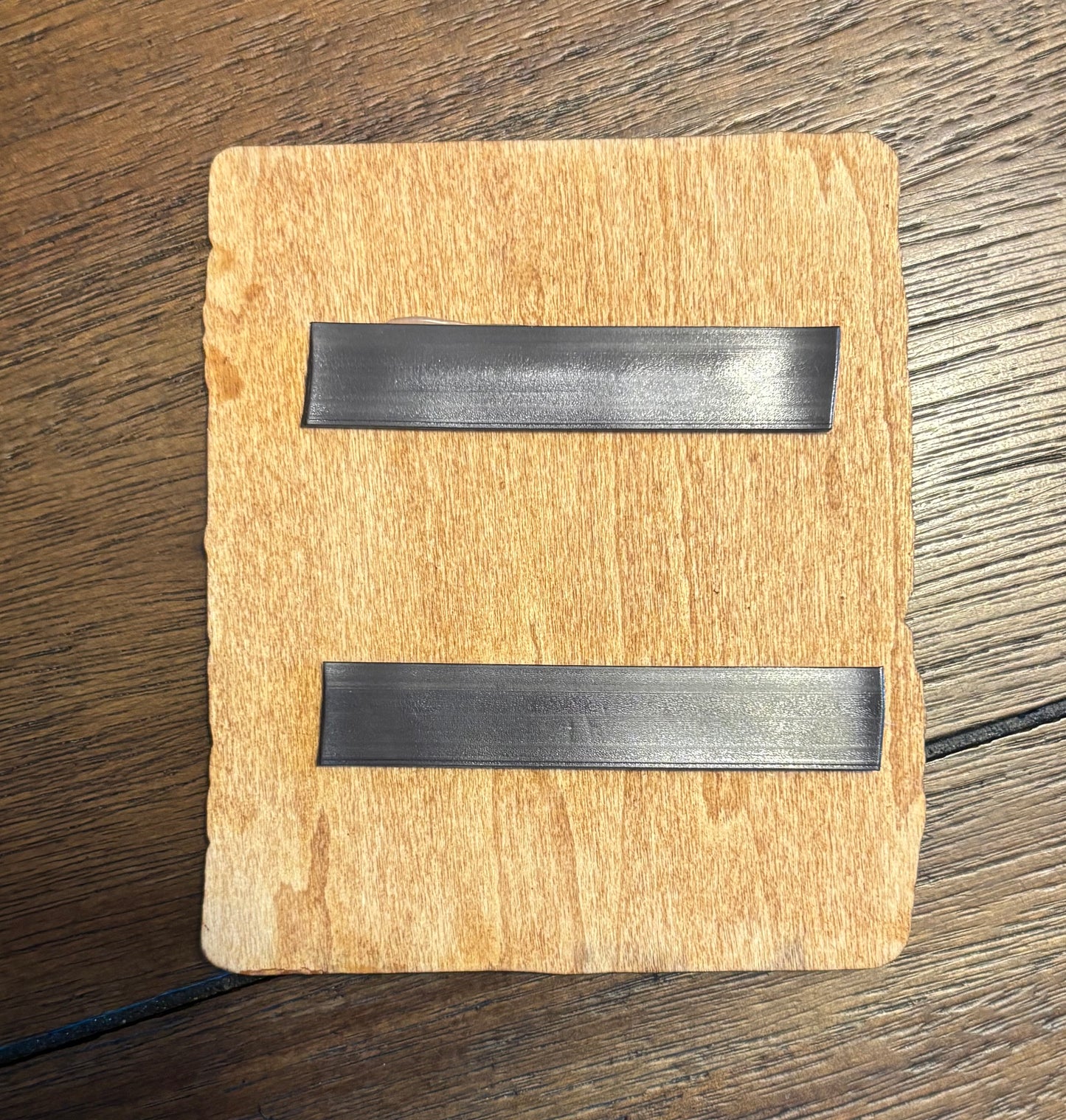 Stained basswood fridge magnet of the We Know note from the Skyrim video game