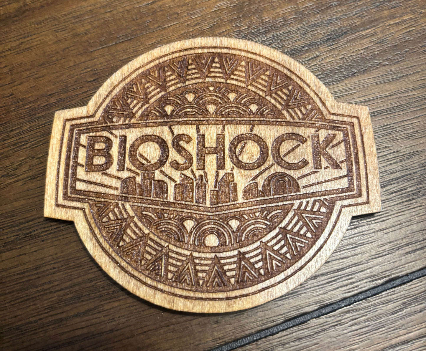 Stained basswood fridge magnet of Bioshock logo
