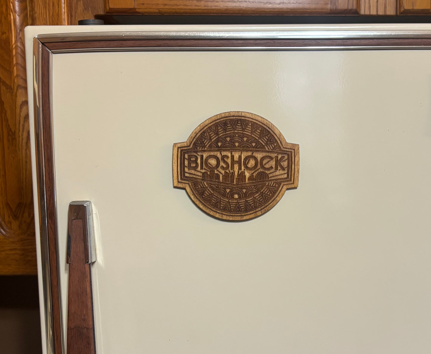 Stained basswood fridge magnet of Bioshock logo