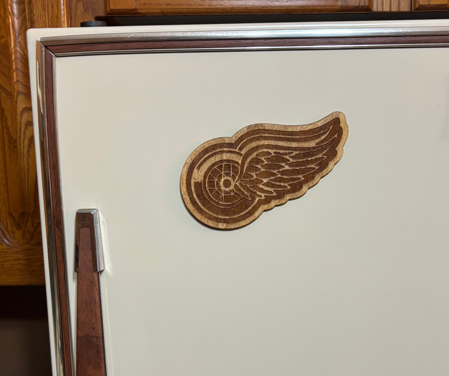 Stained basswood fridge magnet of the Detroit Red Wings hockey team logo