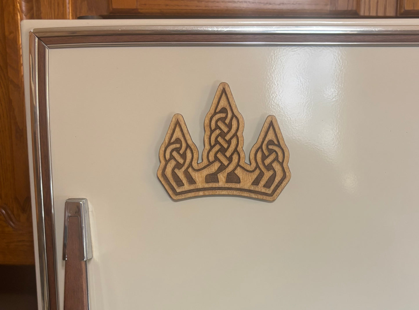 Stained basswood fridge magnet of the Winterhold sigil from the Skyrim video game