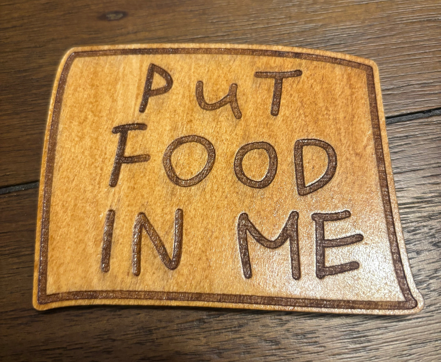 Stained basswood fridge magnet of Flanders' Put Food in Me sticky note from the Simpsons