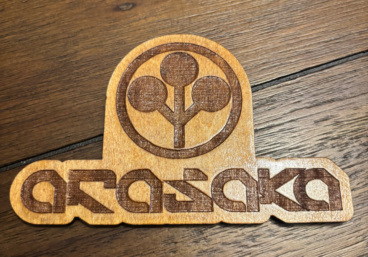 Stained basswood fridge magnet of the Arasaka logo from the Cyberpunk 2077 video game
