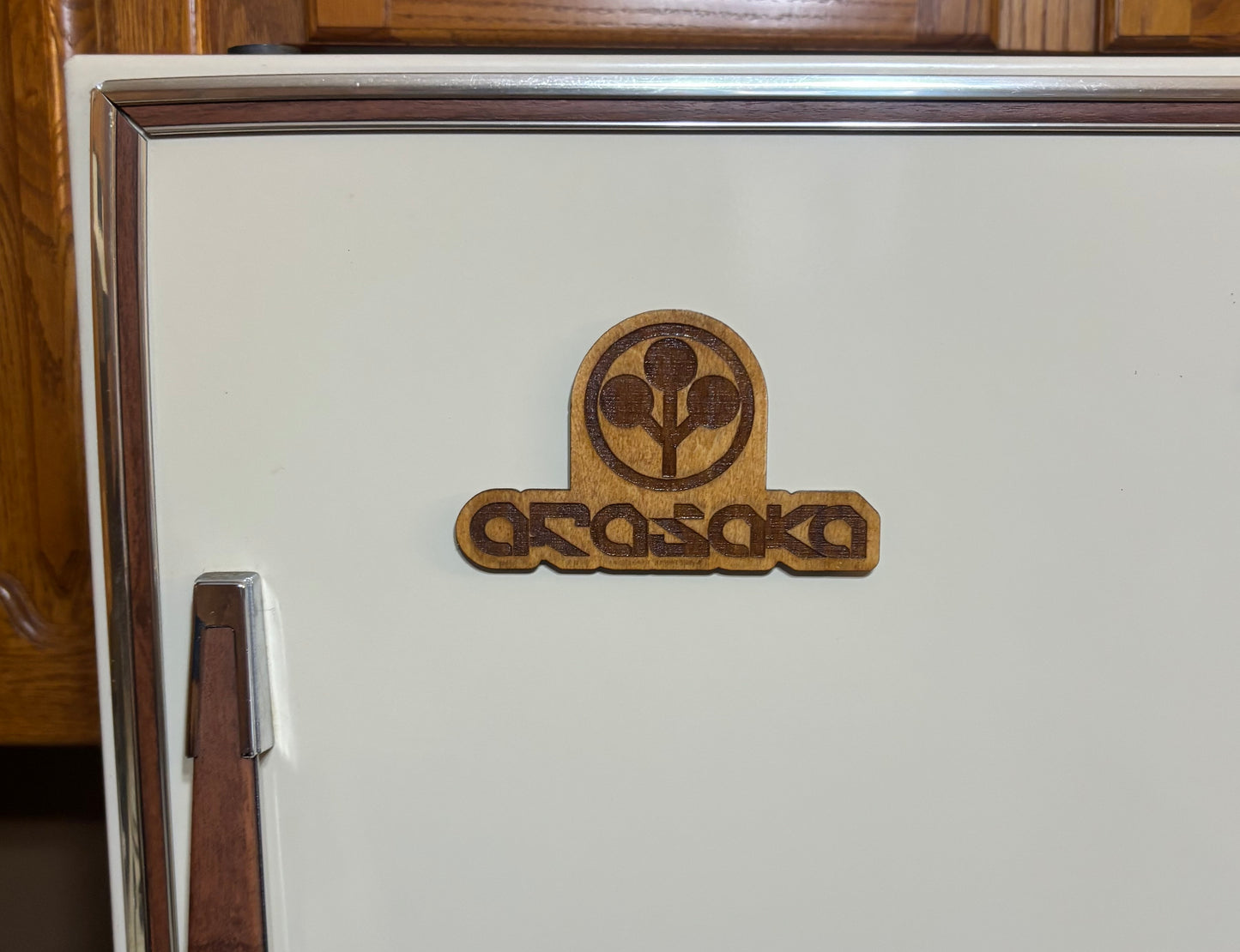 Stained basswood fridge magnet of the Arasaka logo from the Cyberpunk 2077 video game