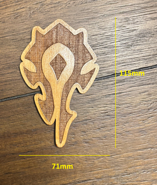 Stained basswood fridge magnet of a the Orcish Horde symbol from the Warcraft video games