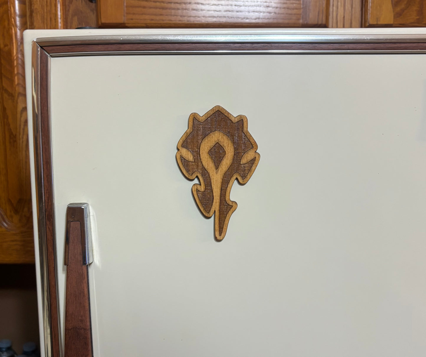 Stained basswood fridge magnet of a the Orcish Horde symbol from the Warcraft video games