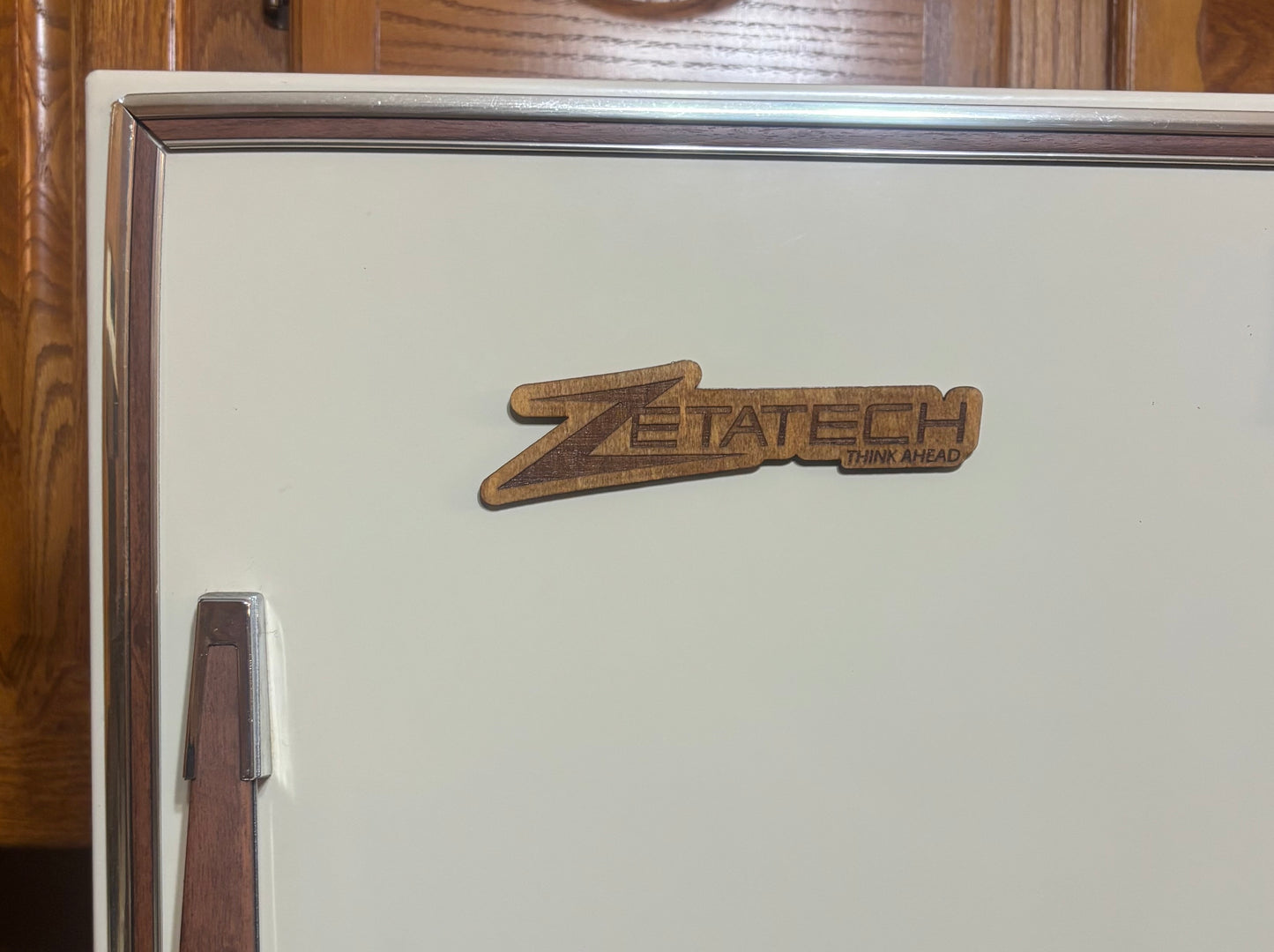Stained basswood fridge magnet of the Zetatech logo from the Cyberpunk 2077 video game