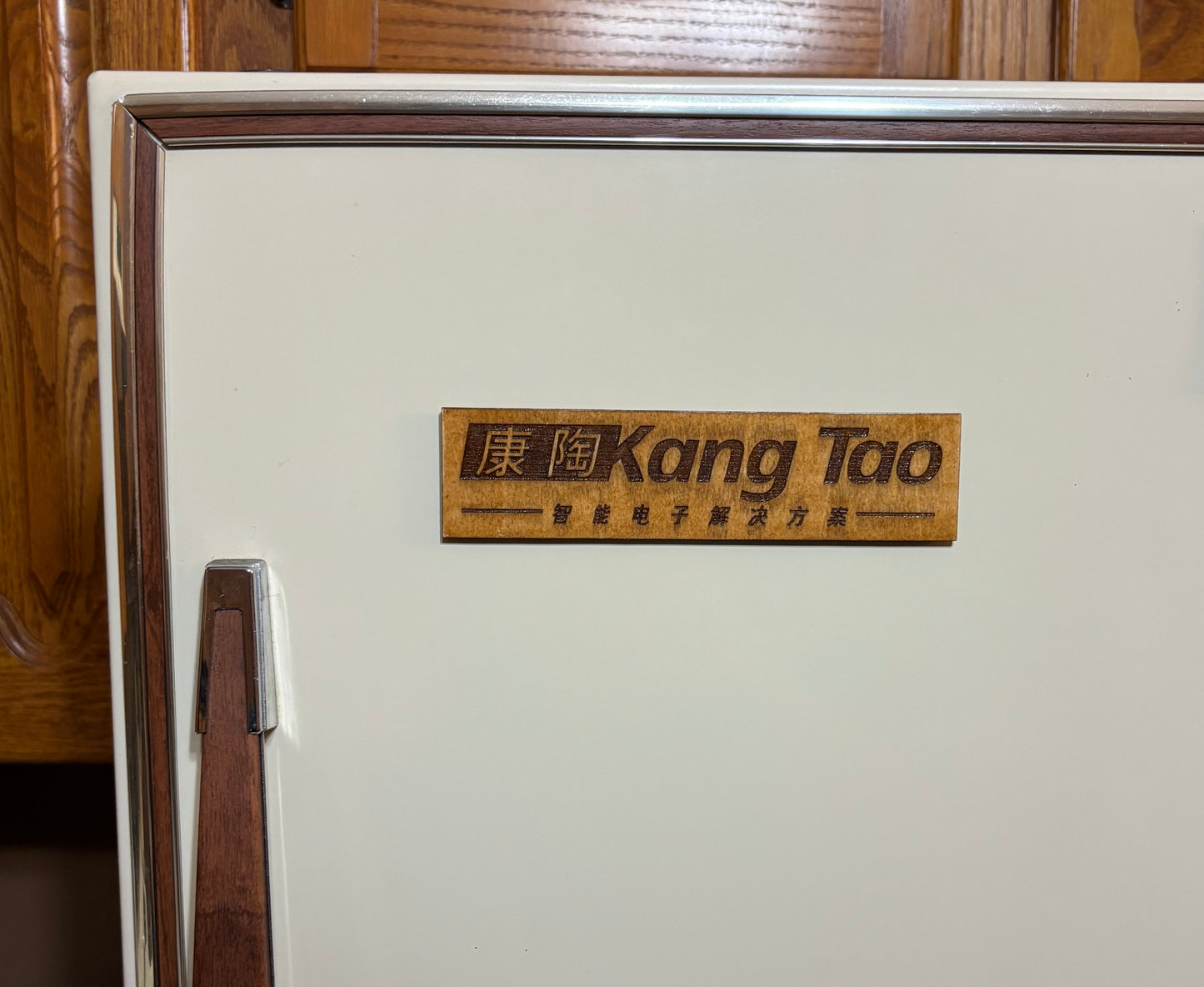 Stained basswood fridge magnet of the Kang Tao logo from the Cyberpunk 2077 video game