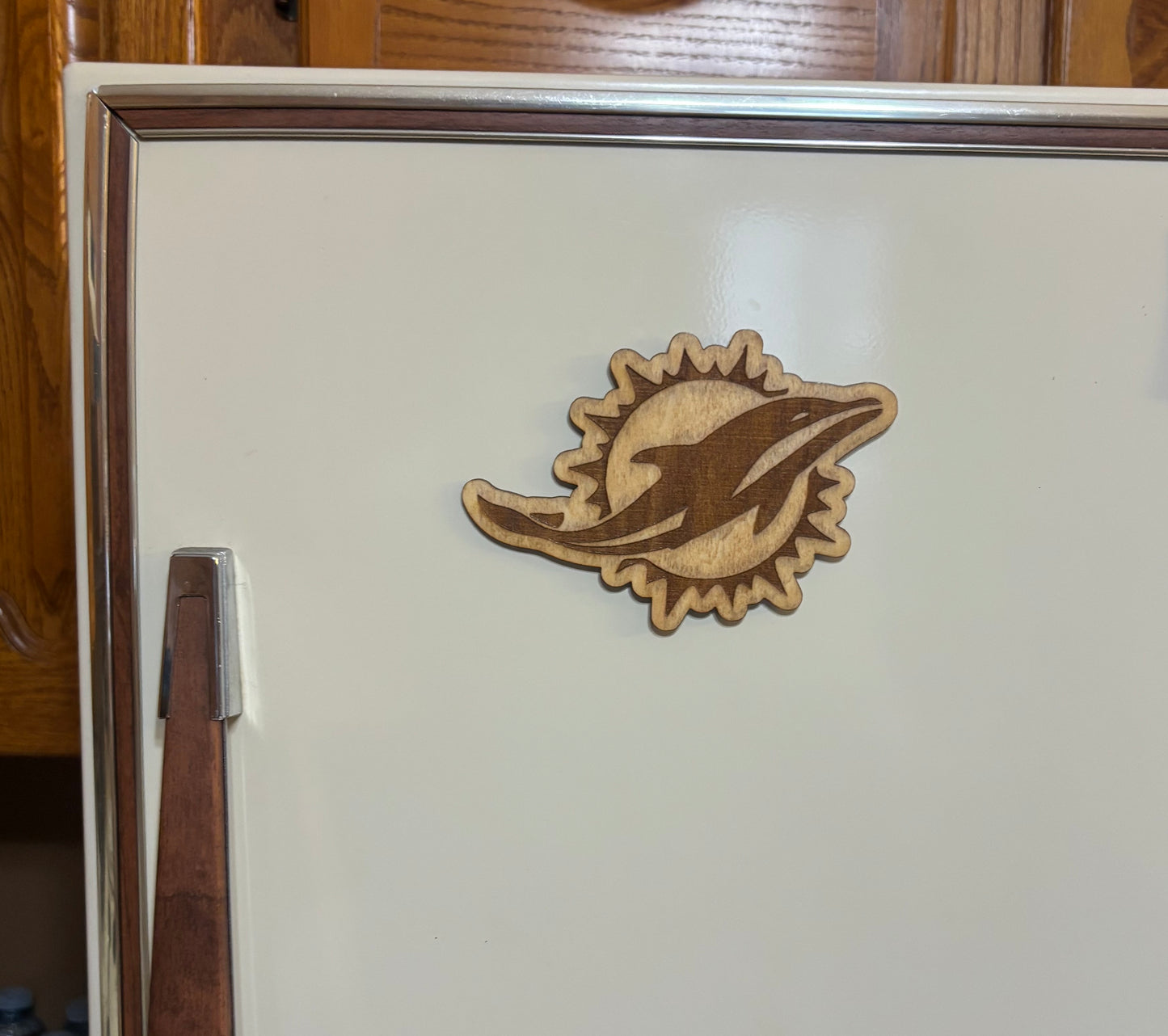 Stained basswood fridge magnet of the Miami Dolphins football team logo