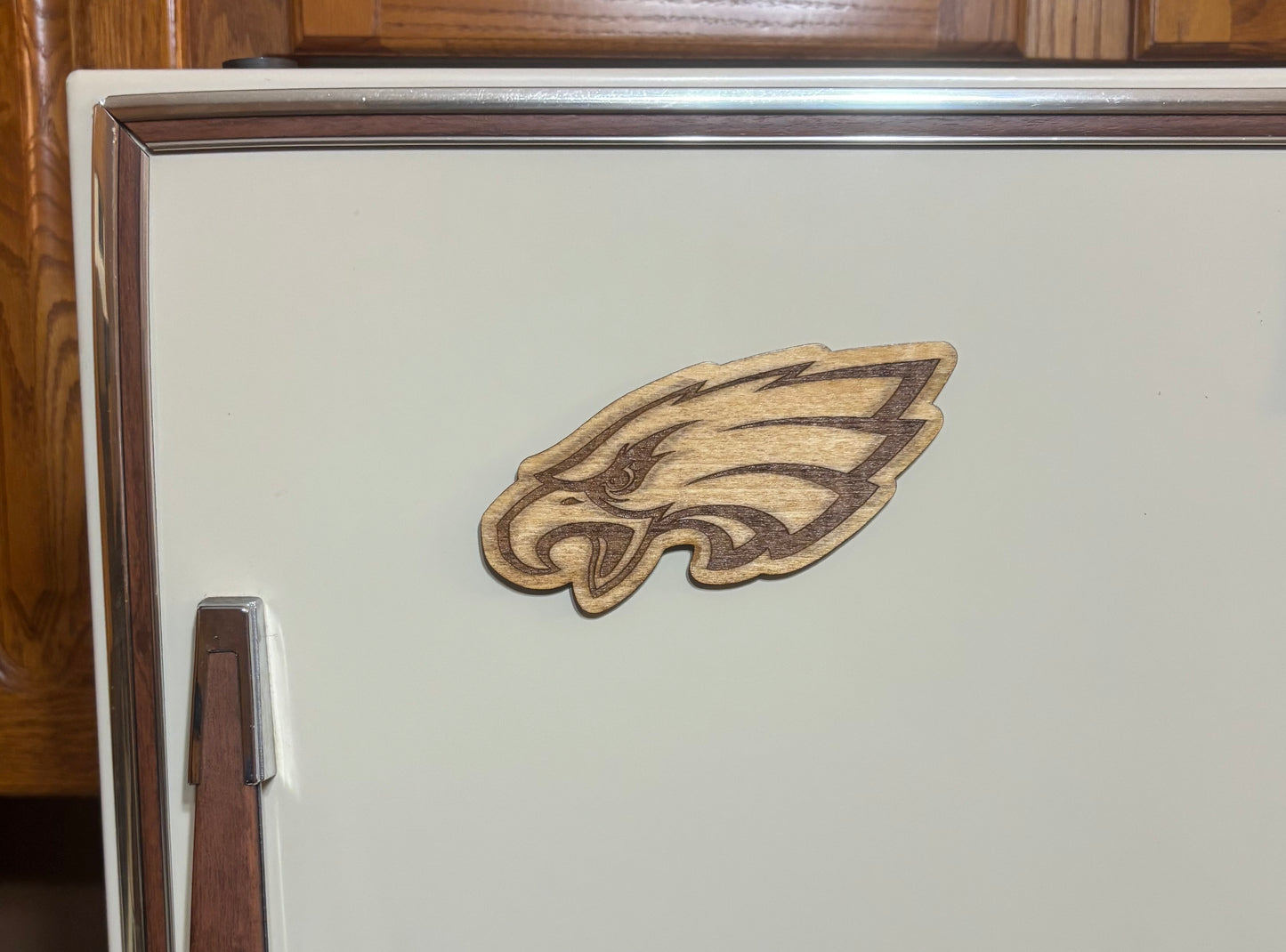 Stained basswood fridge magnet of the Philadelphia Eagles football team logo