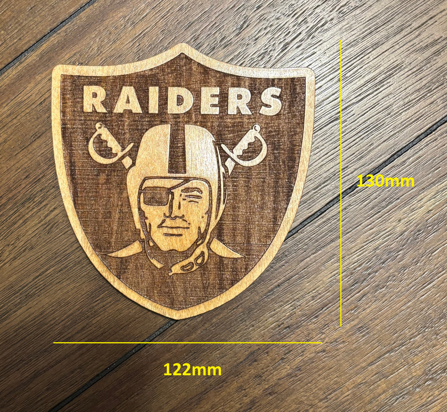 Stained basswood fridge magnet of the Las Vegas Raiders football team logo