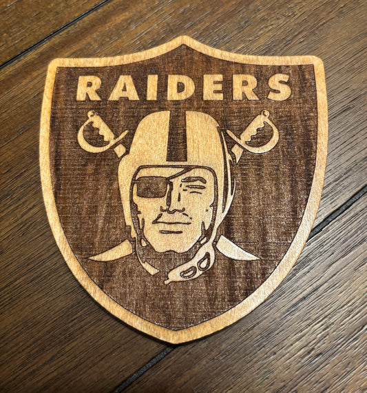 Stained basswood fridge magnet of the Las Vegas Raiders football team logo