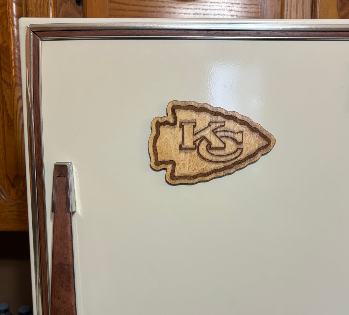 Stained basswood fridge magnet of the Kansas City Chiefs football team logo