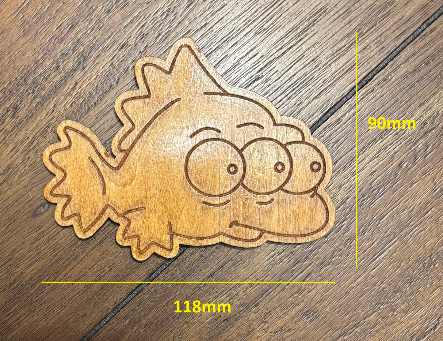 Stained basswood fridge magnet of Blinky from the Simpsons