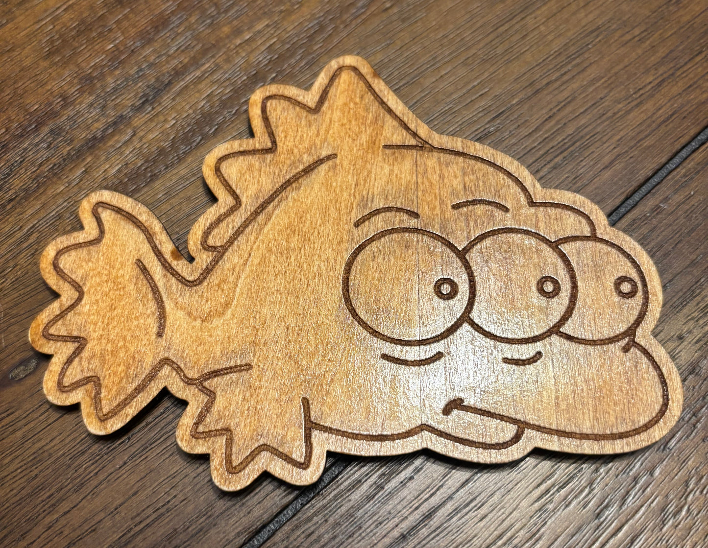 Stained basswood fridge magnet of Blinky from the Simpsons