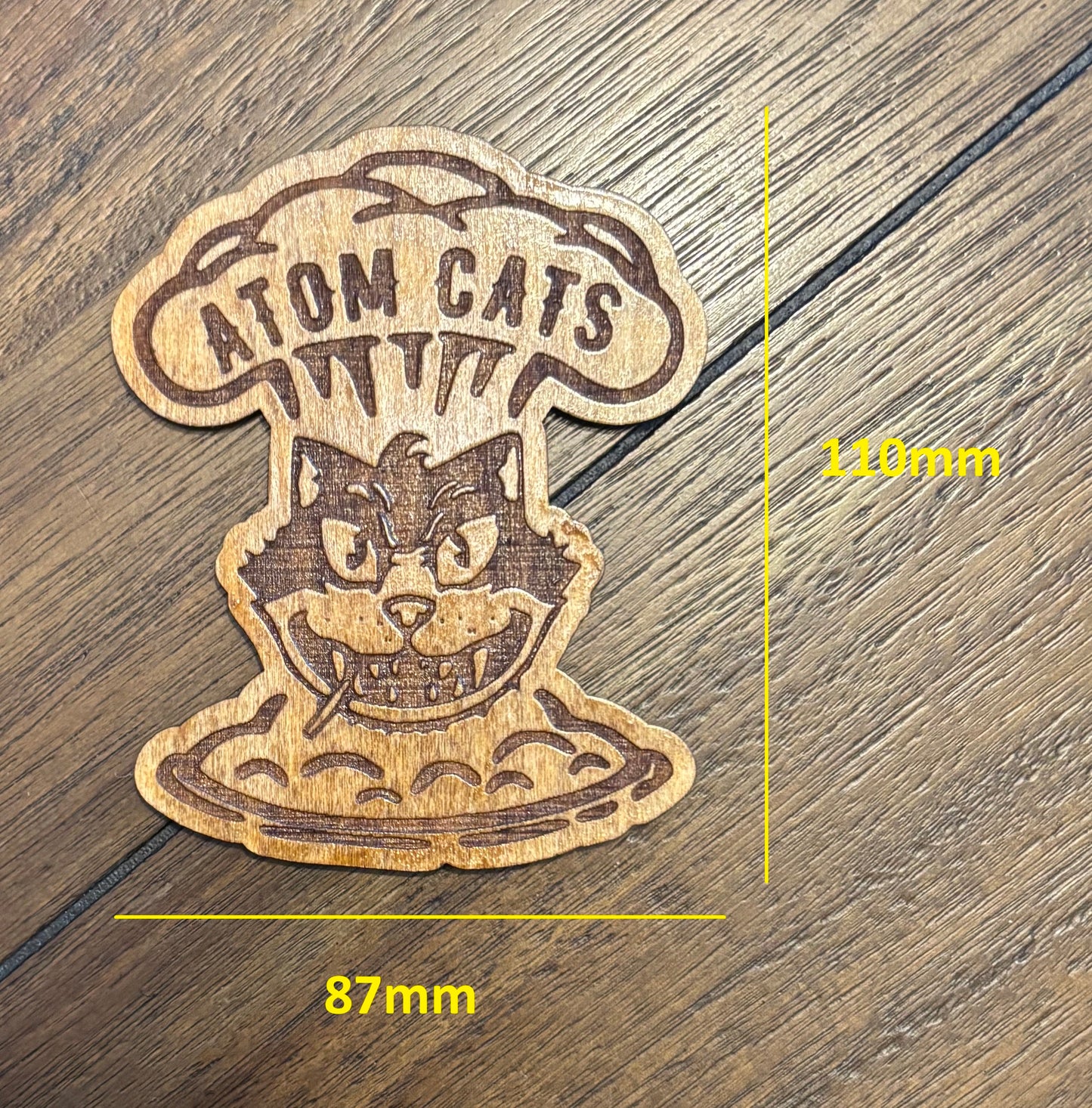 Stained basswood fridge magnet of the Atom Cats logo from the Fallout video games