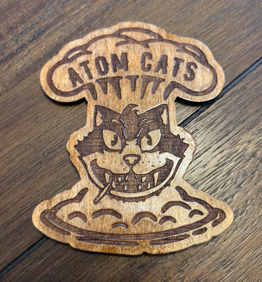 Stained basswood fridge magnet of the Atom Cats logo from the Fallout video games