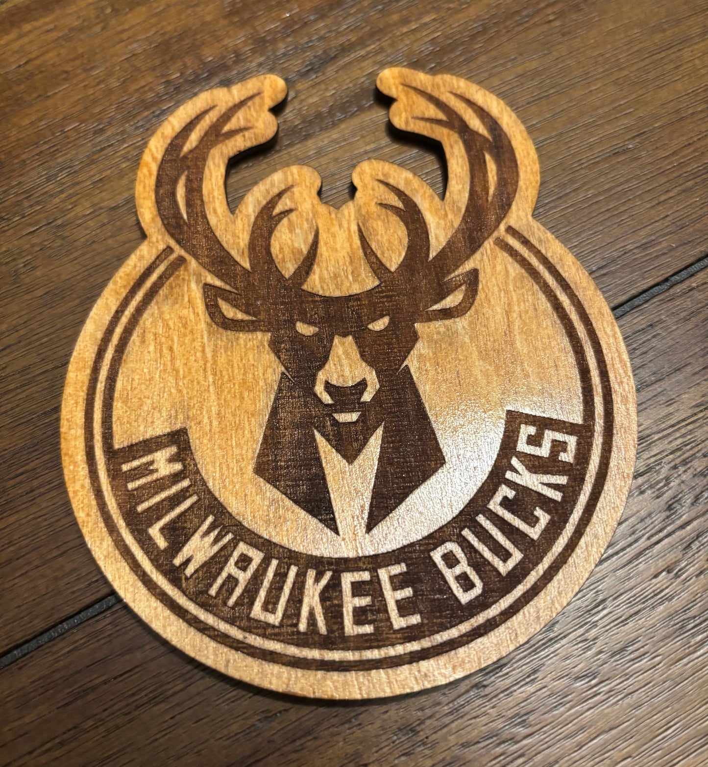 Stained basswood fridge magnet of the Milwaukee Bucks basketball team logo