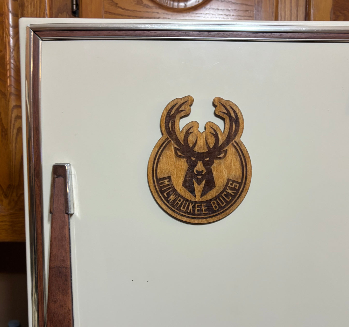 Stained basswood fridge magnet of the Milwaukee Bucks basketball team logo