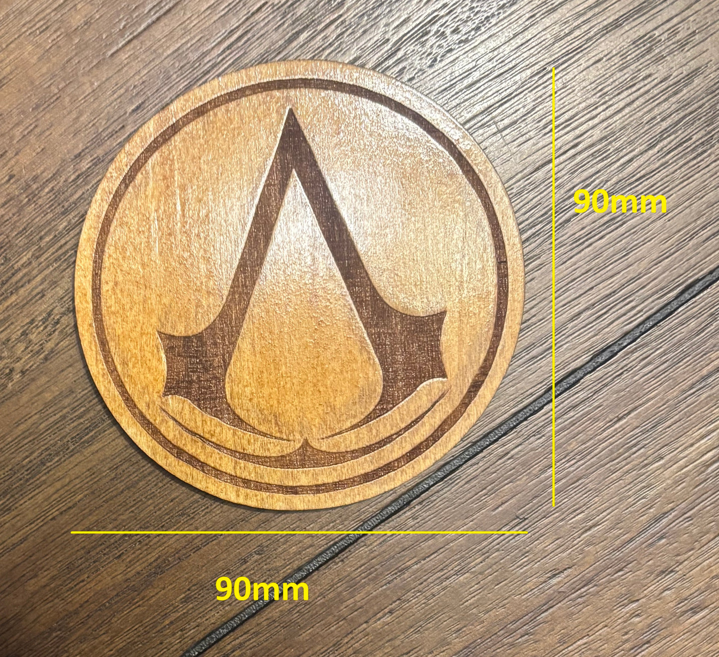 Stained basswood fridge magnet of the Assassin's Creed logo