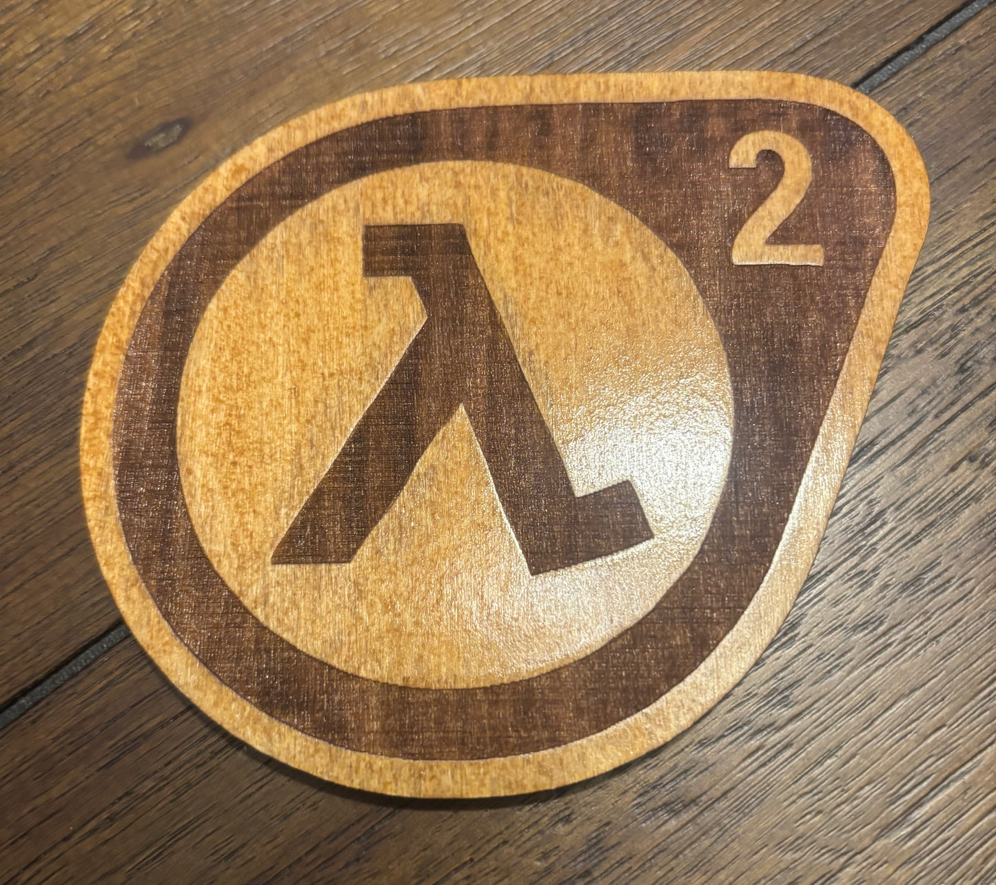 Stained basswood fridge magnet of the Half-Life 2 logo