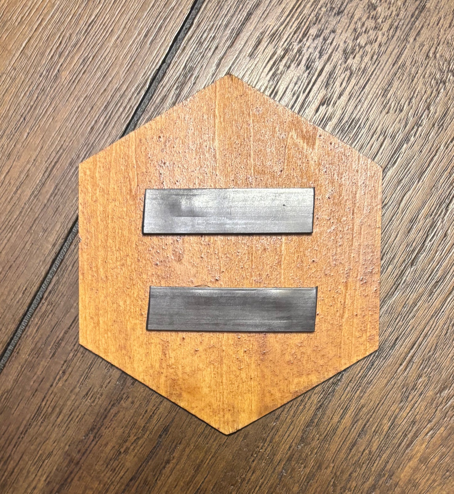 Stained basswood fridge magnet of the Exalt logo from the X-COM video games