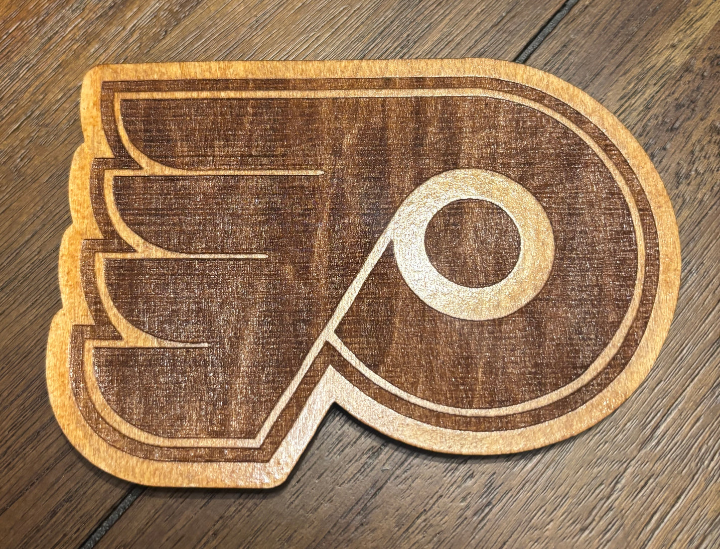 Stained basswood fridge magnet of the Philadelphia Flyers hockey team logo