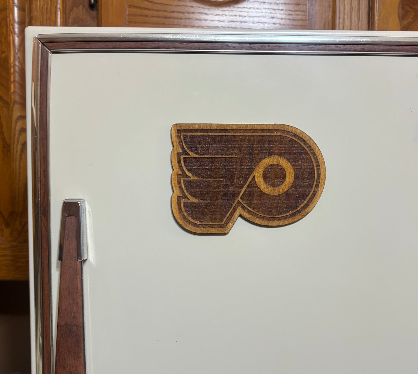 Stained basswood fridge magnet of the Philadelphia Flyers hockey team logo