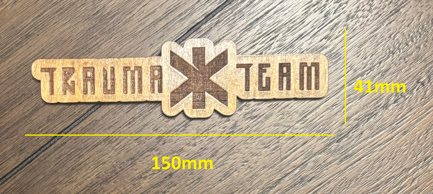 Stained basswood fridge magnet of the Trauma Team logo from the Cyberpunk 2077 video game