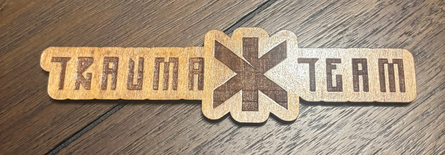 Stained basswood fridge magnet of the Trauma Team logo from the Cyberpunk 2077 video game