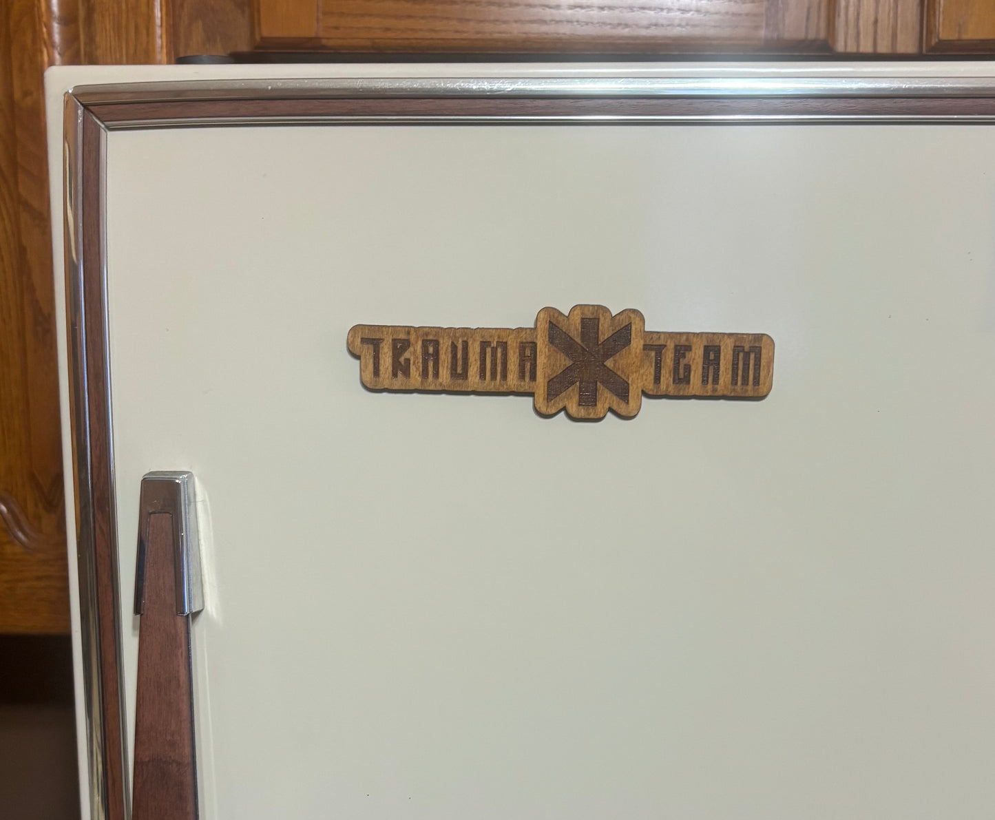 Stained basswood fridge magnet of the Trauma Team logo from the Cyberpunk 2077 video game