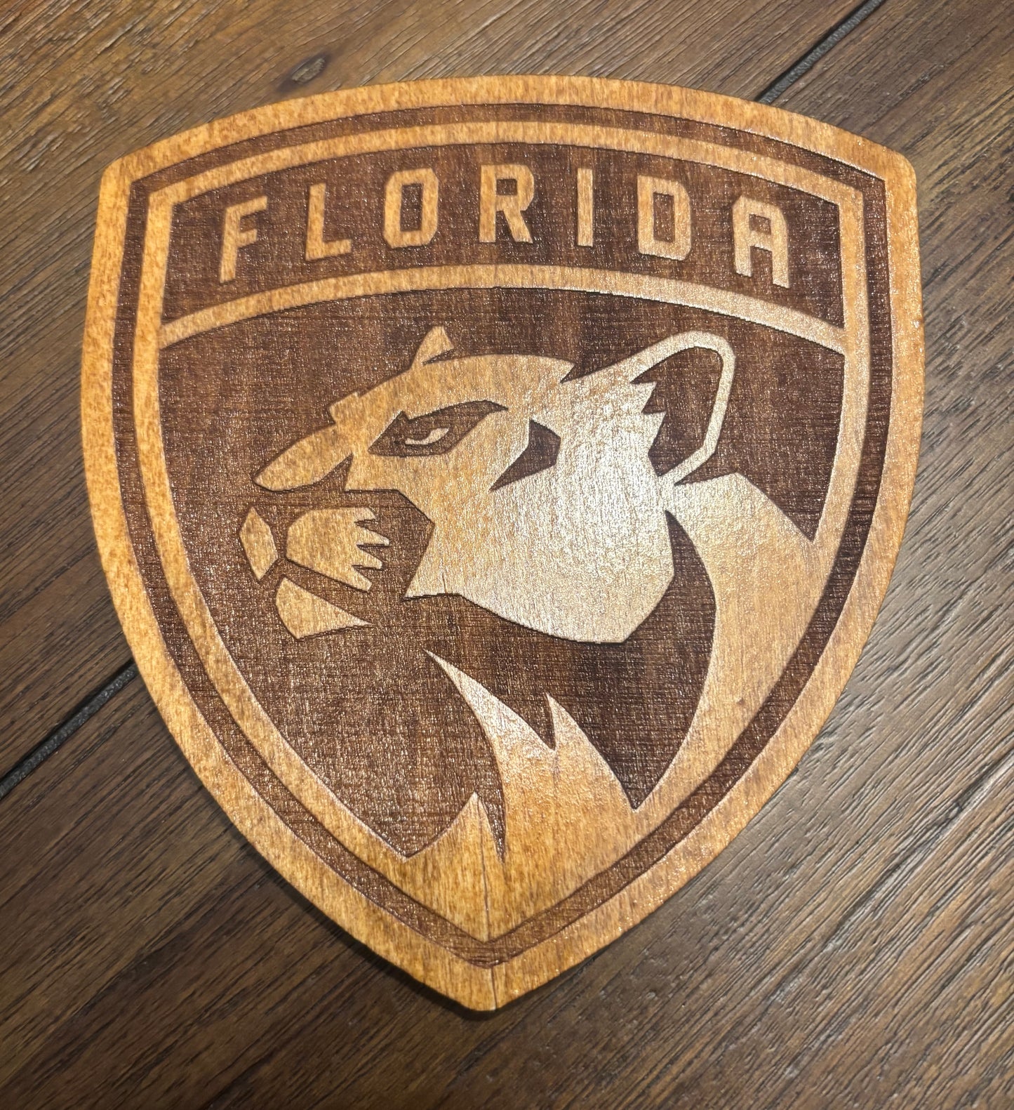Stained basswood fridge magnet of the Florida Panthers hockey team logo