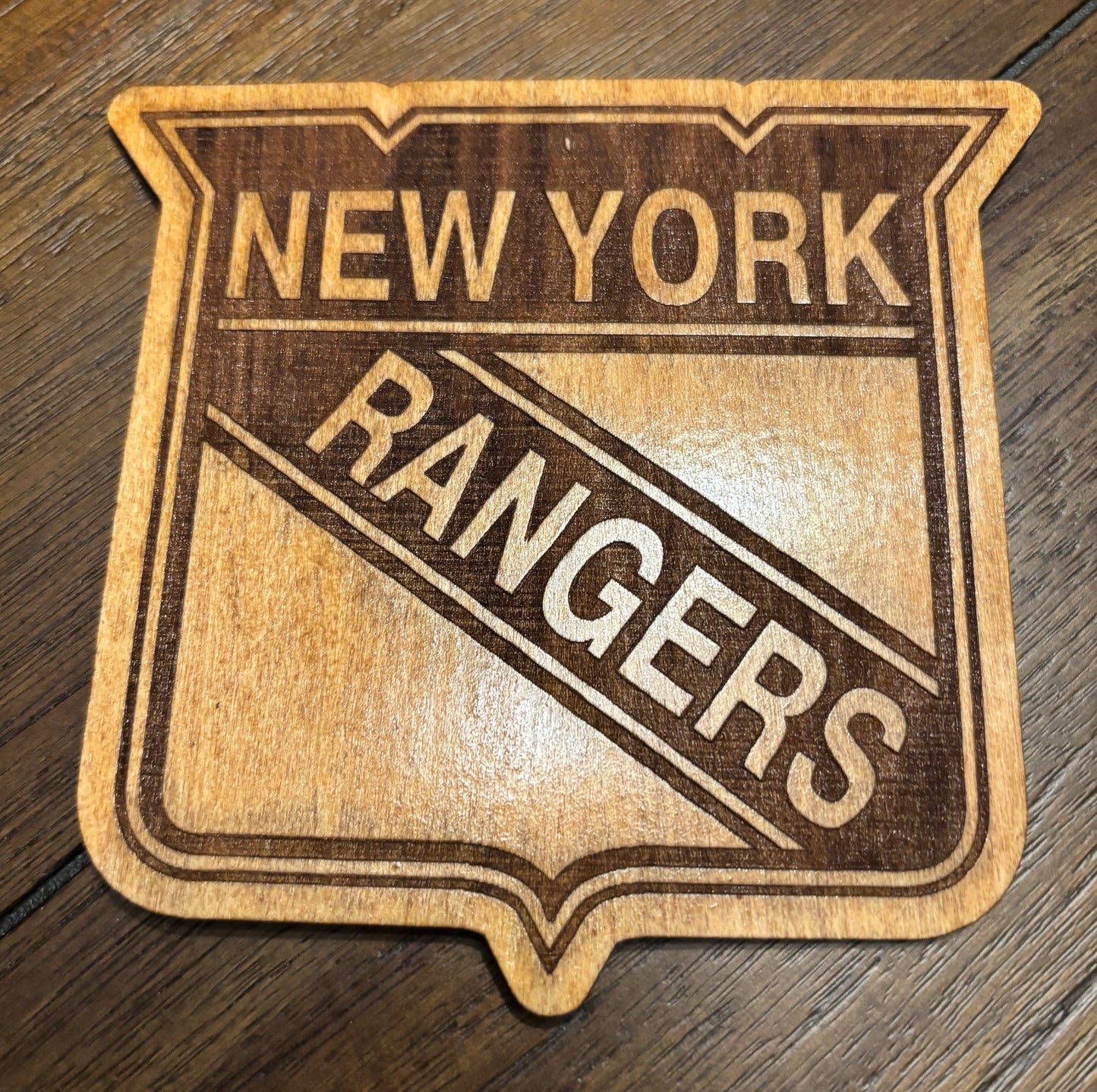 Stained basswood fridge magnet of the New York Rangers hockey team logo