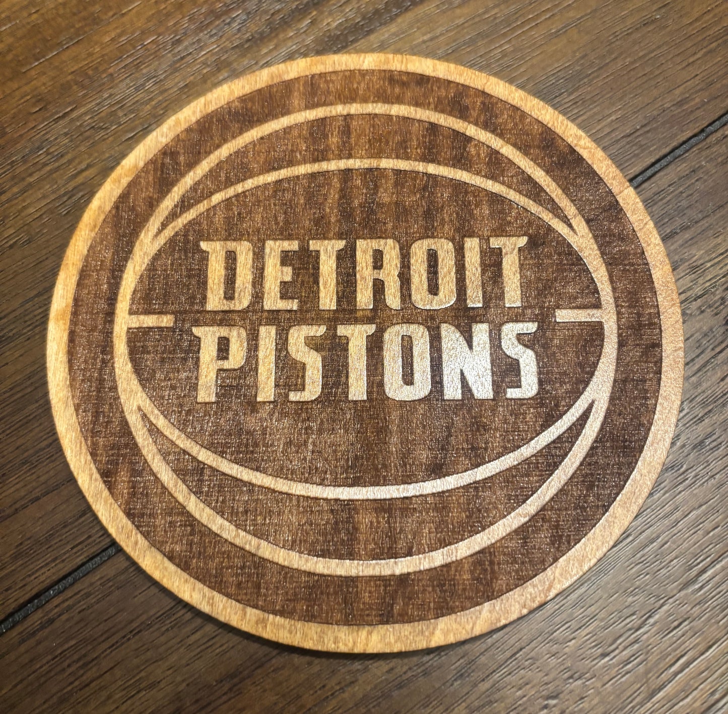 Stained basswood fridge magnet of the Detroit Pistons basketball team logo