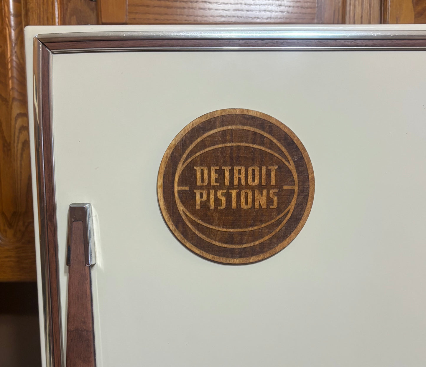 Stained basswood fridge magnet of the Detroit Pistons basketball team logo