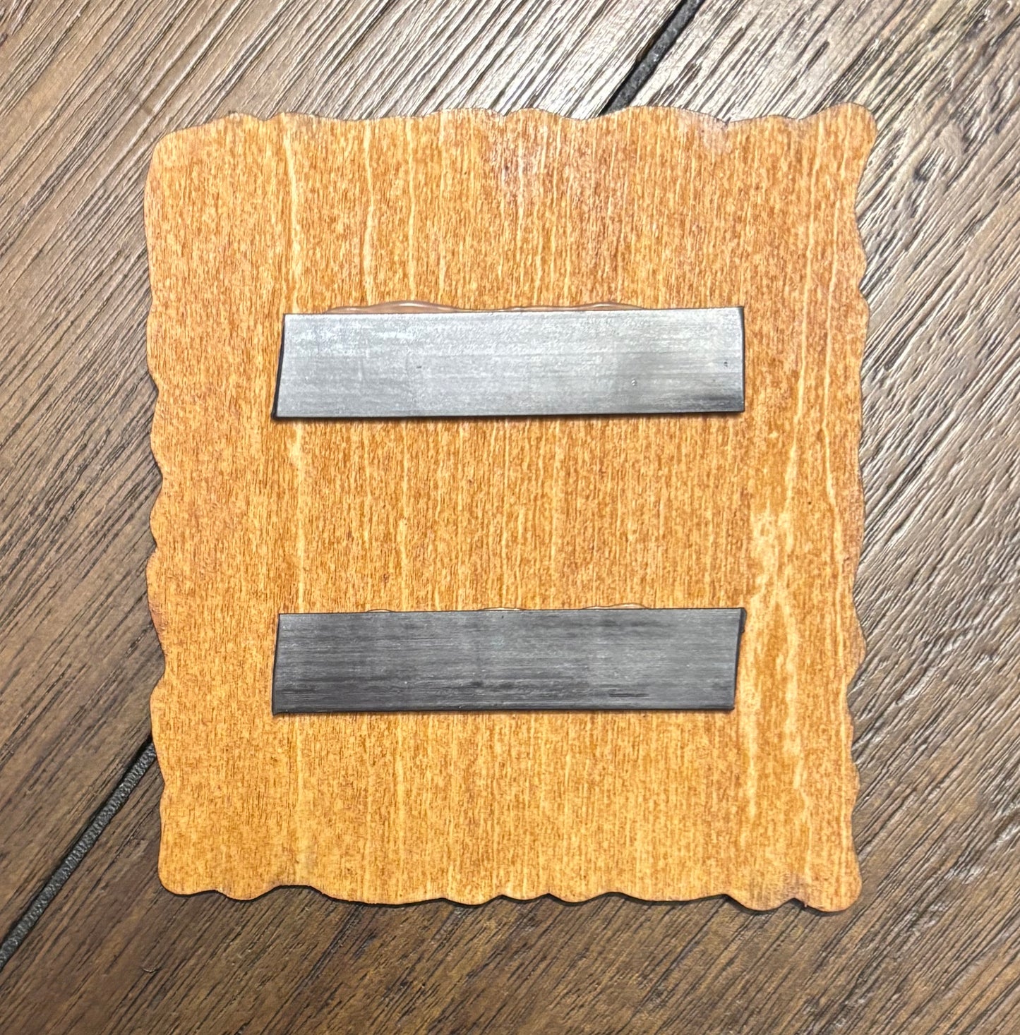Stained basswood fridge magnet of the Maelstrom logo from the Cyberpunk 2077 video game