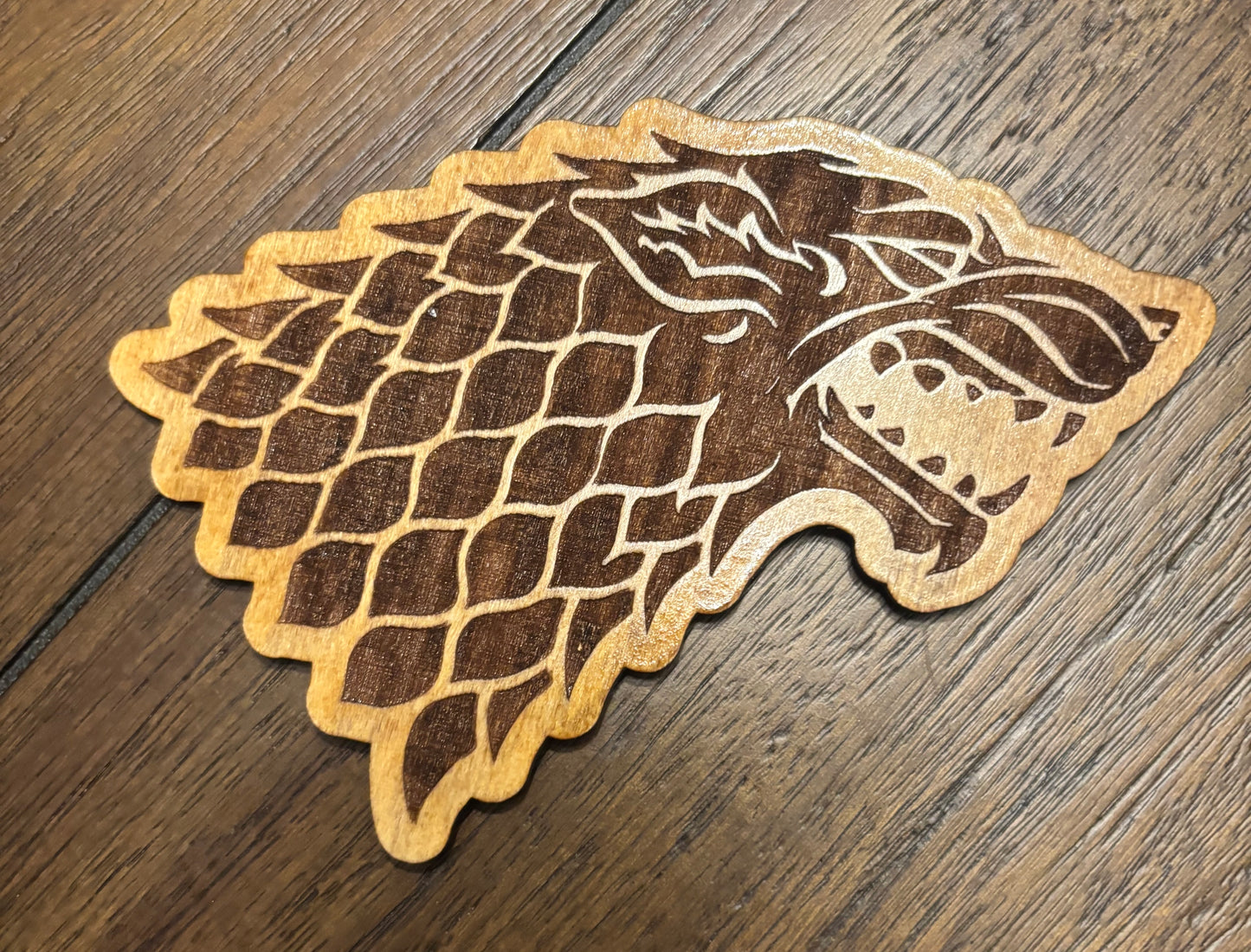 Stained basswood fridge magnet of the House Stark sigil from Game of Thrones