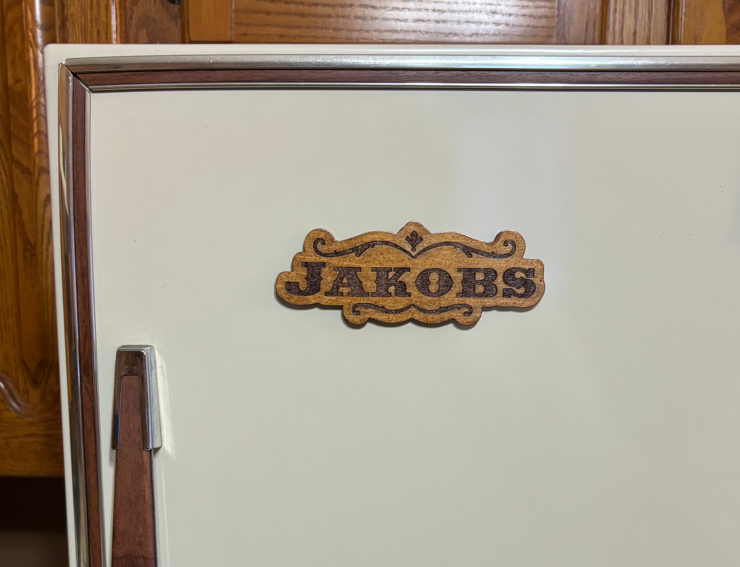 Stained basswood fridge magnet of the Jakobs logo from the Borderlands video games