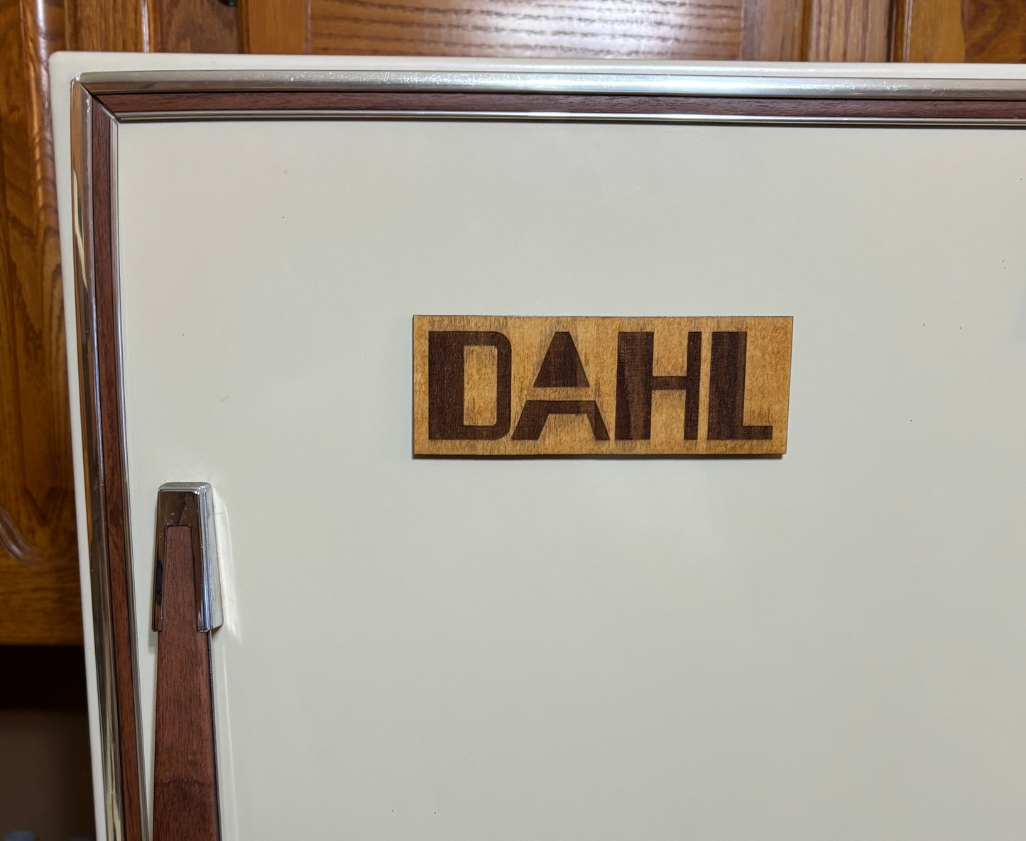 Stained basswood fridge magnet of the Dahl logo from the Borderlands video games