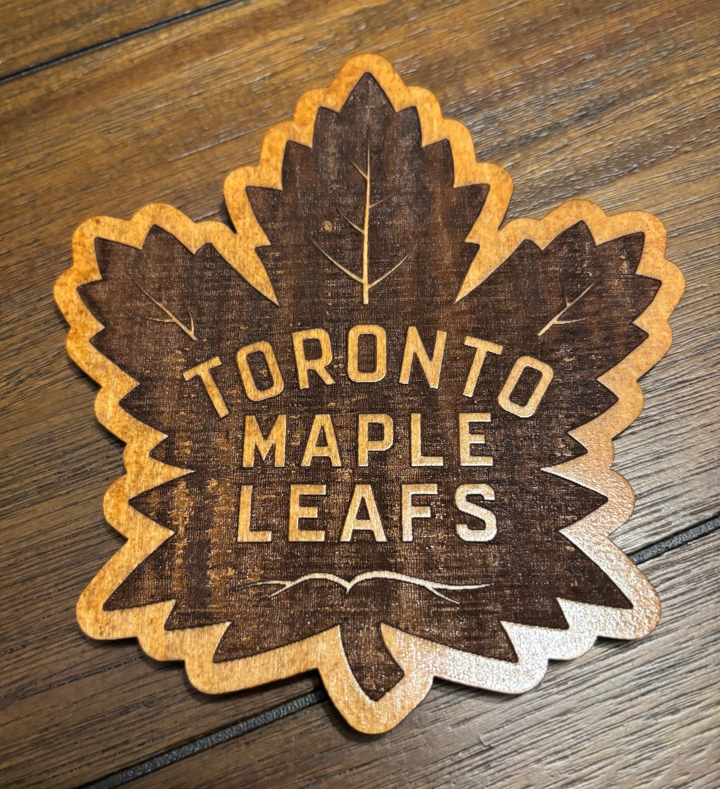 Stained basswood fridge magnet of the Toronto Maple Leafs hockey team logo