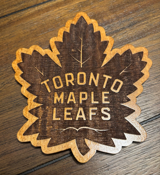 Stained basswood fridge magnet of the Toronto Maple Leafs hockey team logo
