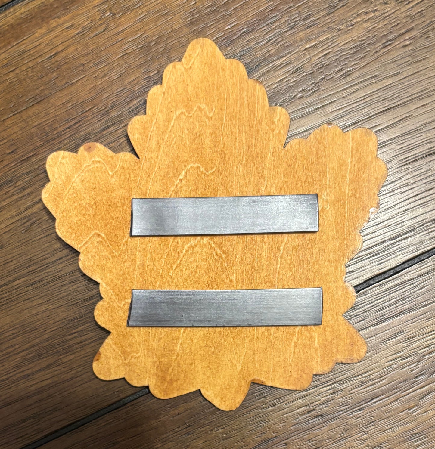 Stained basswood fridge magnet of the Toronto Maple Leafs hockey team logo