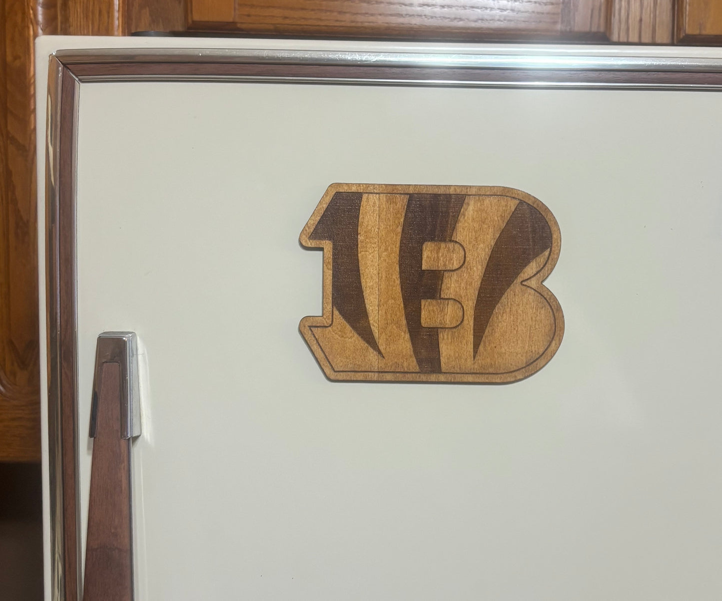Stained basswood fridge magnet of the Cincinnati Bengals football team logo
