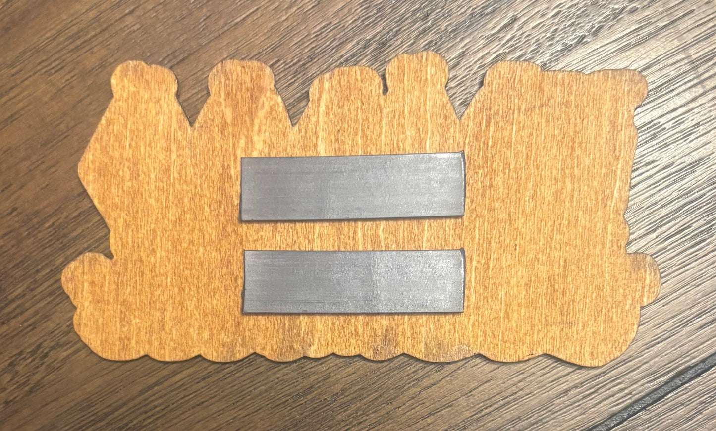 Stained basswood fridge magnet of the Voodoo Boys logo from the Cyberpunk 2077 video game