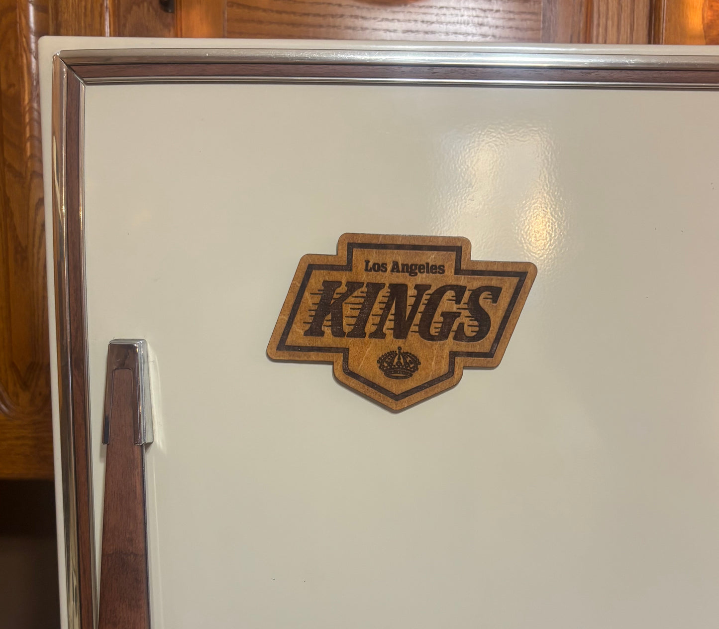 Stained basswood fridge magnet of the Los Angeles Kings hockey team logo