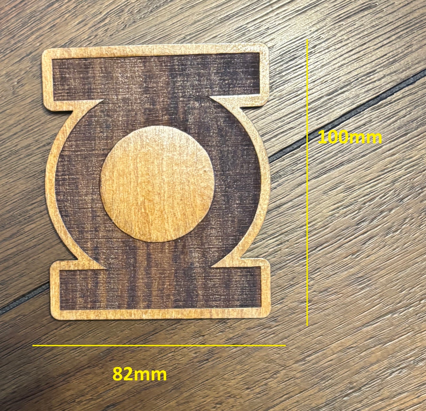 Stained basswood fridge magnet of the Green Lantern logo